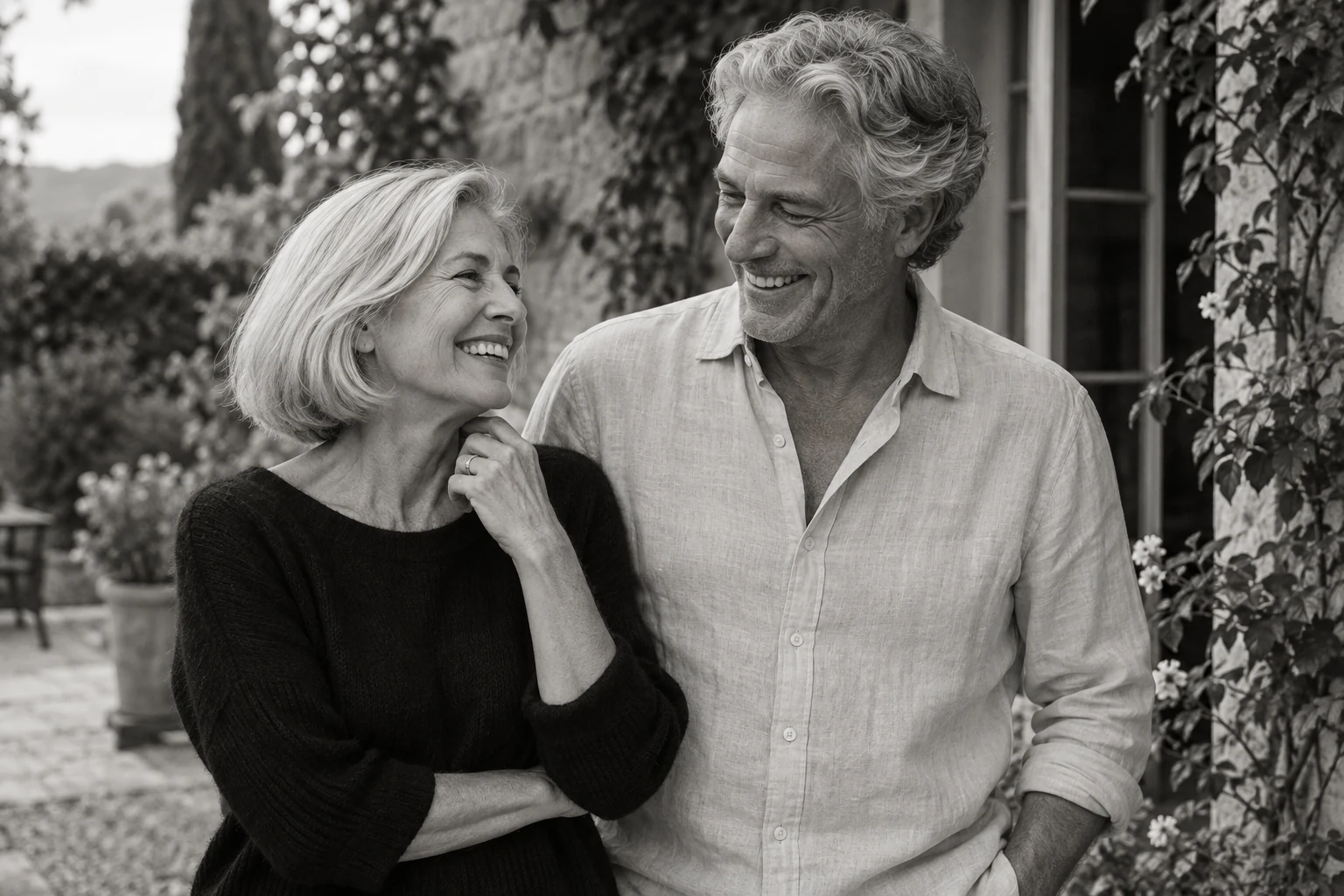 A smiling older couple sharing a candid moment; illustrative photograph